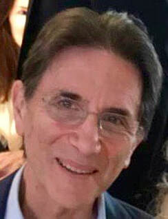 Photo of Lou Giansante, brown hair with rimless glasses