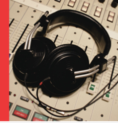 Black headphones lying on a beige studio consolePicture